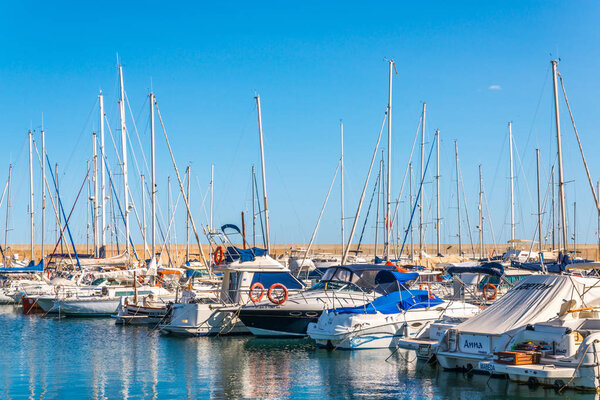 TORREDEMBARRA, SPAIN - SEPTEMBER 10, 2017   A beautiful marina with luxury yachts and motor boats in the tourist seaside town of Torredembarra