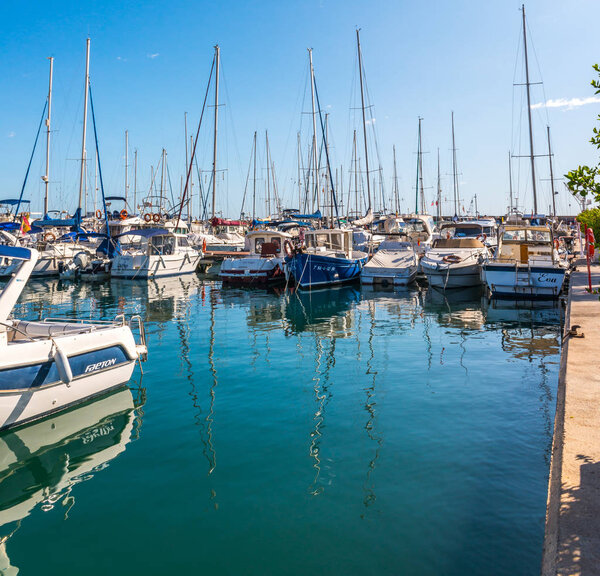 TORREDEMBARRA, SPAIN - SEPTEMBER 10, 2017   A beautiful marina with luxury yachts and motor boats in the tourist seaside town of Torredembarra