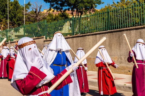 stock image VELEZ-MALAGA, SPAIN - MARCH 27, 2018 People participating in the procession  in the Holy Week in a Spanish city, easter