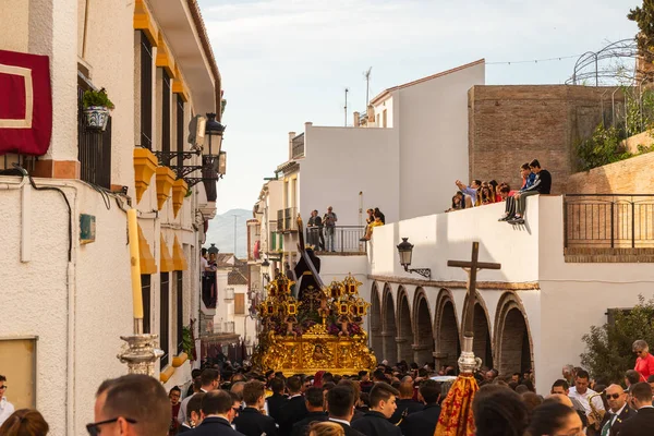 stock image VELEZ-MALAGA, SPAIN - MARCH 29, 2018 People participating in the procession  in the Holy Week in a Spanish city, easter