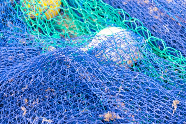 Industrial Fishing Equipment Fishnets and Fishing Lines lying on
