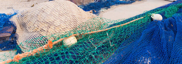 Industrial Fishing Equipment Fishnets and Fishing Lines lying on