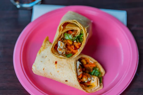 Chicken breast with piri piri sauce and lettuce in a chili torti — Stock Photo, Image