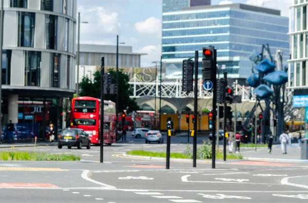 LONDON, UK - MAY 21, 2019 Red double-decker bus driving down the — Stock Photo, Image