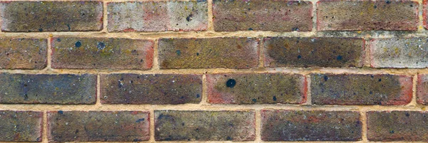 Old brick placed in the wall, interesting and original backgroun — Stock Photo, Image