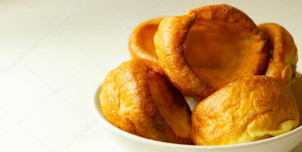 Traditional English Yorkshire pudding, wonderfully crisp and golden baked for a traditional recipe, accompaniment for the perfect Sunday roast, English food