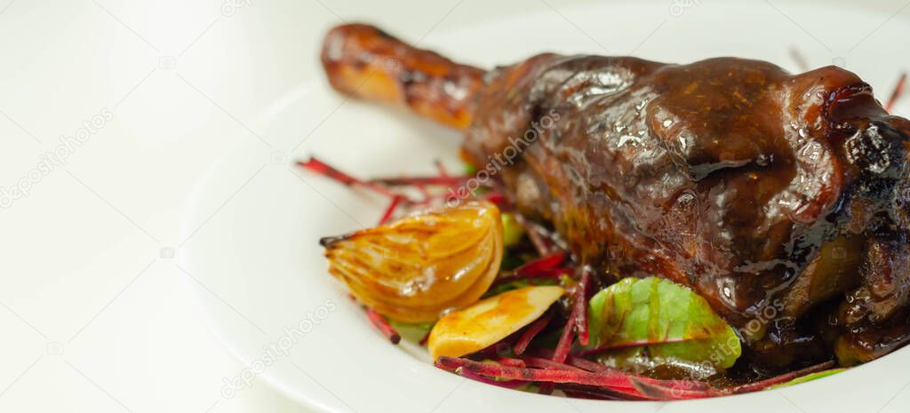 Delicious Lamb shank with red wine and rosemary gravy served on the mixed leaf salad, exclusive dish