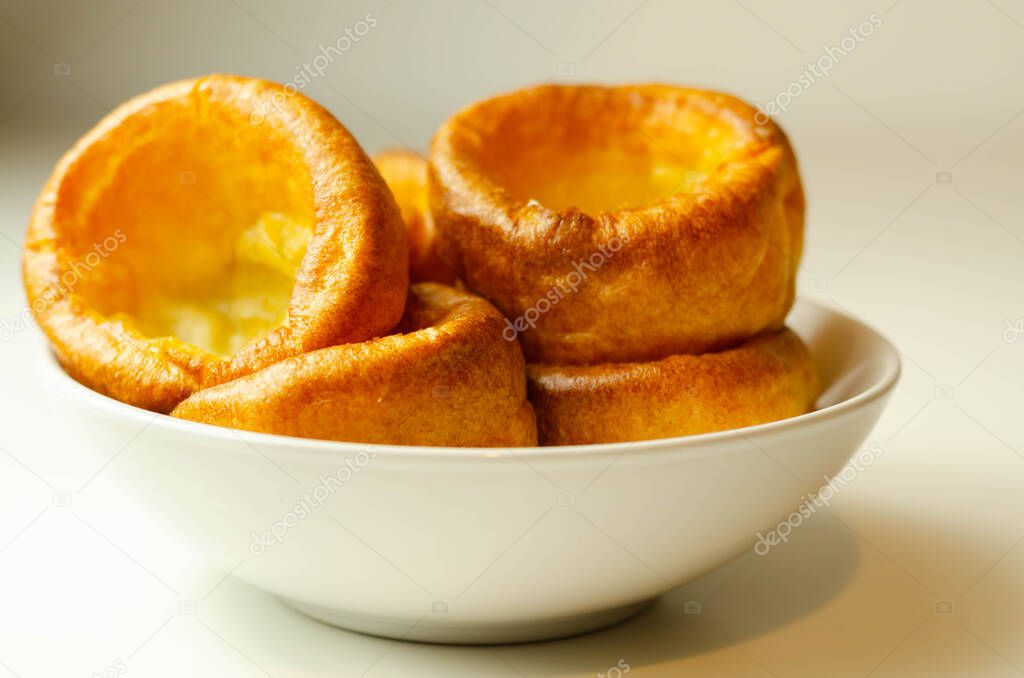 Traditional English Yorkshire pudding, wonderfully crisp and golden baked for a traditional recipe, accompaniment for the perfect Sunday roast, English food