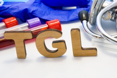 TGL abbreviature mean triglyceride simple blood test  with lab tubes with blood and stethoscope. Using acronym TGL in laboratory clinical diagnosis, measure the level of triglycerides in blood clipart