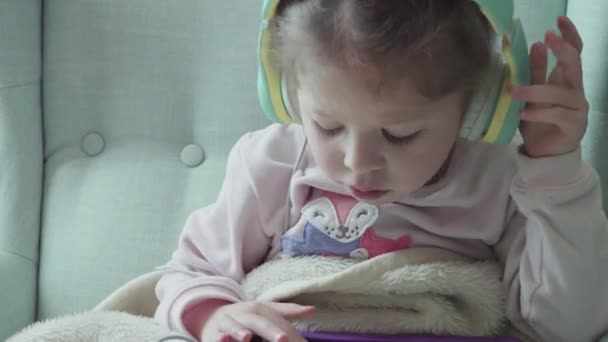 Little Girl Reading Book Her Tablet — Stock Video