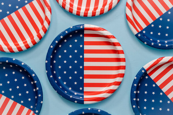 July 4th theme paper plate on blue background.
