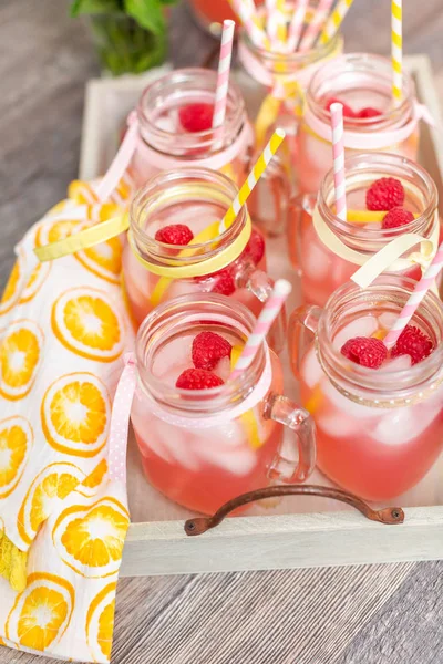 Raspberry Lemonade Garnished Fresh Lemon Raspberries Drinking Mason Jars — Stock Photo, Image