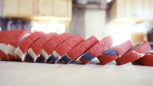 Slicing Red White Blue Pinwheel Cookie Dough Individual Cookies — Stock Video