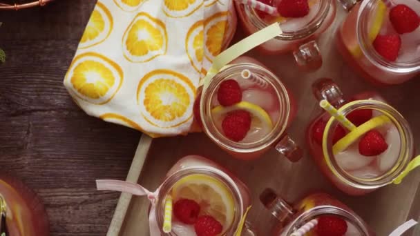 Raspberry Lemonade Garnished Fresh Lemon Raspberries Drinking Mason Jars — Stock Video