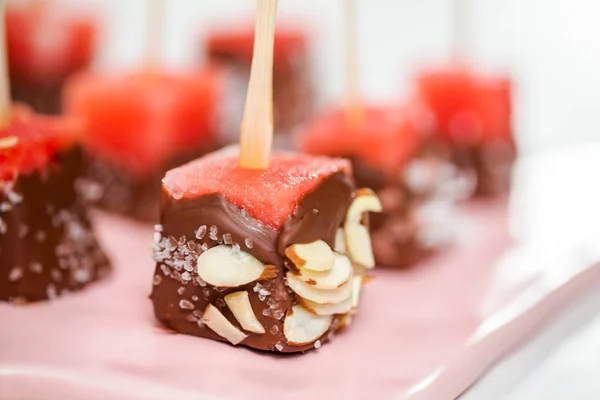 Preparing Watermelon Appetizers Dipped Chocolate Sprinked Sea Salt Almonds — Stock Photo, Image