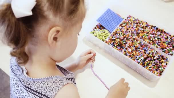 Little Girl Making Bracelet Colorful Kids Beads — Stock Video