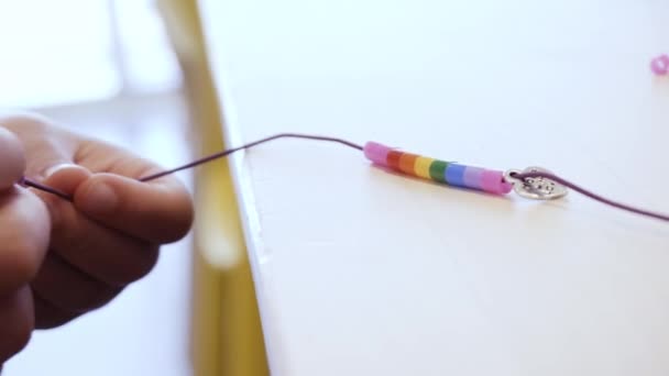 Close Kids Hands Stringing Colorful Beads Make Bracelet — Stock Video