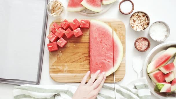 Slicing Watermelon Cubes Preparing Watermelon Appetizers Dipped Chocolate Sprinked Sea — Stock Video