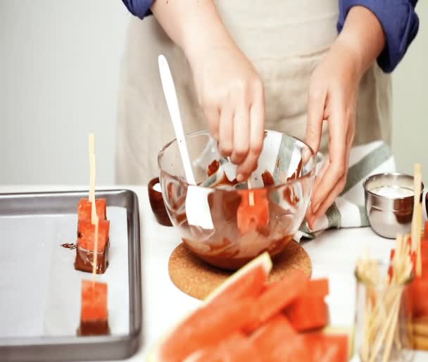 Dipping Watermelon Cubes Melted Chocolate Garnishing Sea Salt Almonds — Stock Video