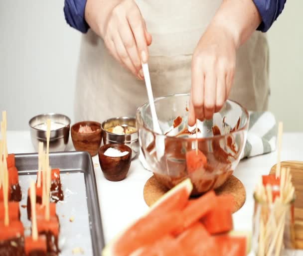 Dipping Watermelon Cubes Melted Chocolate Garnishing Sea Salt Almonds — Stock Video