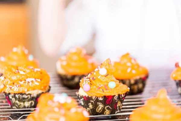 Decorating Orange Icing Cupcakes Sprinkle Mix Stock Picture
