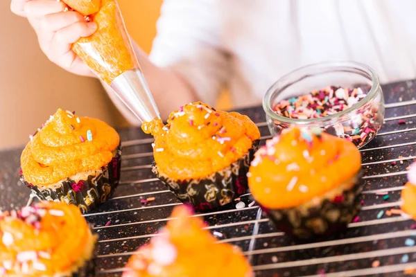Decorating Orange Icing Cupcakes Sprinkle Mix Stock Picture