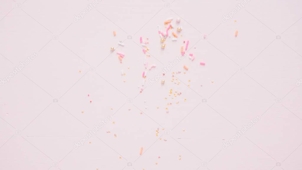 Colorful pink sprinkle blend on a pink background.