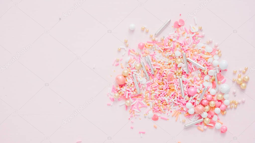 Colorful pink sprinkle blend on a pink background.