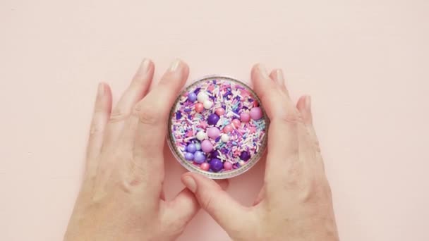 Colorful Purple Sprinkle Blend Pink Background — Stock Video