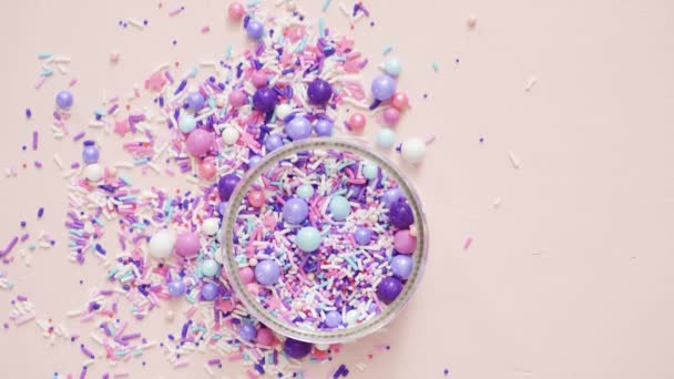 Colorful Purple Sprinkle Blend Pink Background — Stock Video