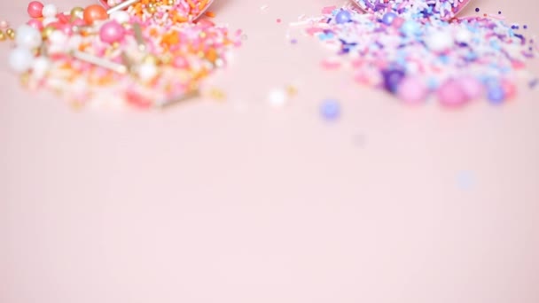 Colorful Sprinkle Blend Pink Background — Stock Video