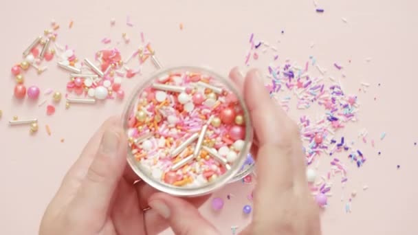 Colorful Sprinkle Blend Pink Background — Stock Video