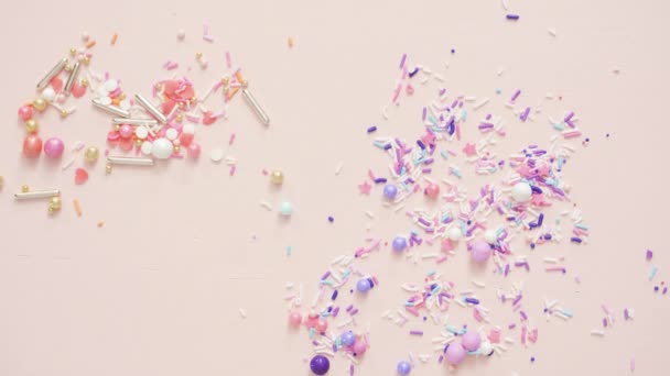 Colorful Sprinkle Blend Pink Background — Stock Video