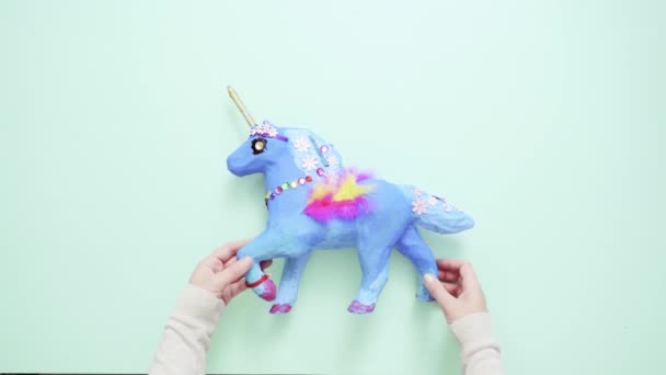 Kids Craft Painted Blue Decorated Jewels Feathers Paper Mache Unicorn — Stock Video