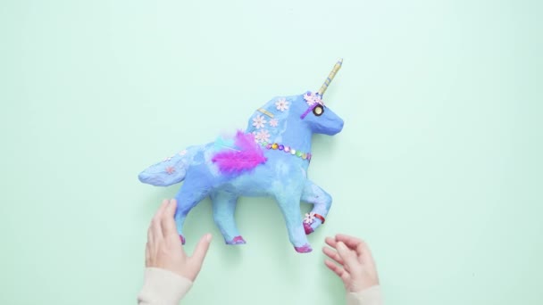 Kids Craft Painted Blue Decorated Jewels Feathers Paper Mache Unicorn — Stock Video