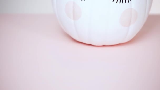 Craft Pumpkin Painted White Decorated Pink Flowers Unicorn Pink Background — Stock Video