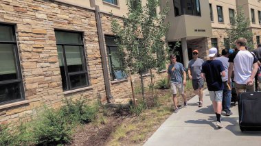 Colorado Springs, Colorado, USA-August 14, 2018- Student moving into the dorms at University of Colorado at Colorado Springs. clipart
