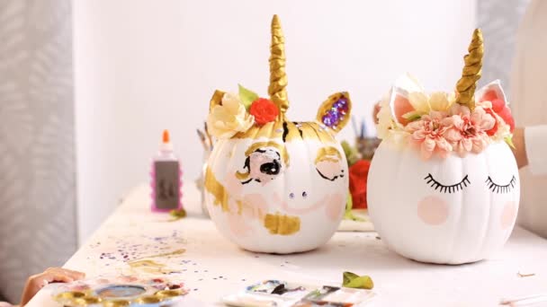 Little Girl Her Mother Painting Face Unicorns Her Craft Pumpkin — Stock Video