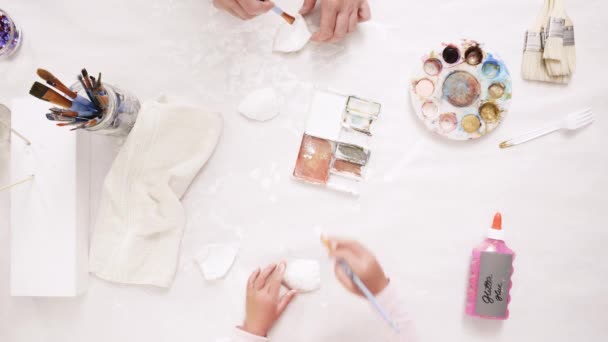 Mother Daughter Painting Gold Paint Clay Sculpted Horn Ears Decorating — Stock Video