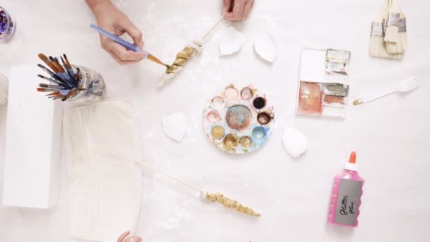 Mother Daughter Painting Gold Paint Clay Sculpted Horn Ears Decorating — Stock Video