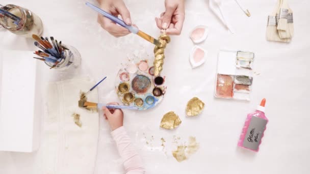 Mother Daughter Painting Gold Paint Clay Sculpted Horn Ears Decorating — Stock Video
