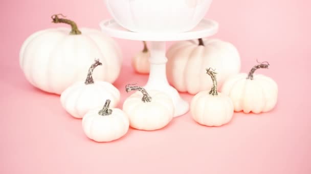 White Unicorn Pumpkin Decorated Flowers Pink Background — Stock Video