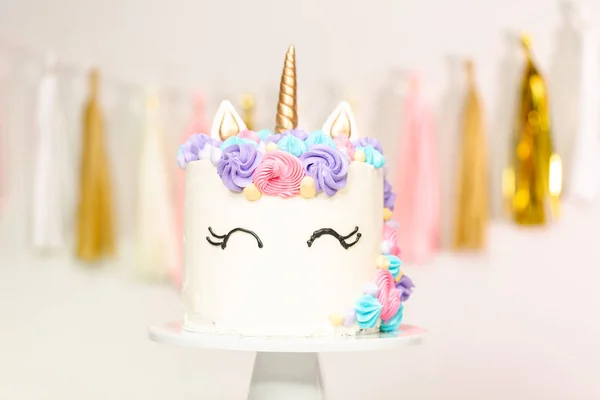 Unicorn cake decorated with multicolor buttercream icing.