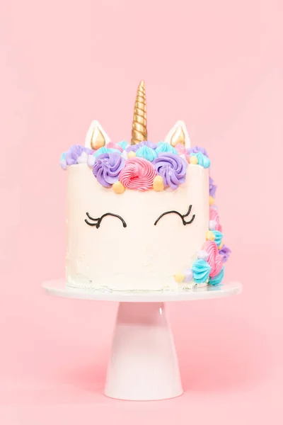 Unicorn cake decorated with multicolor buttercream icing.