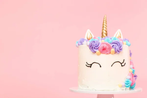 Unicorn cake decorated with multicolor buttercream icing.