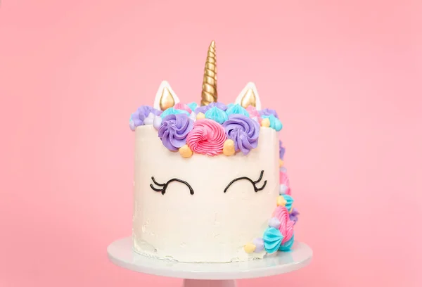 Unicorn cake decorated with multicolor buttercream icing.