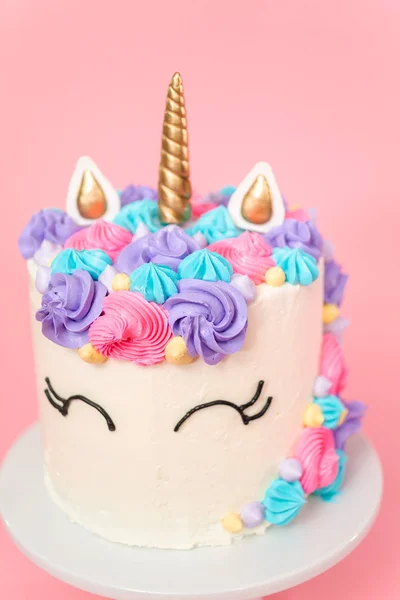 Unicorn cake decorated with multicolor buttercream icing.