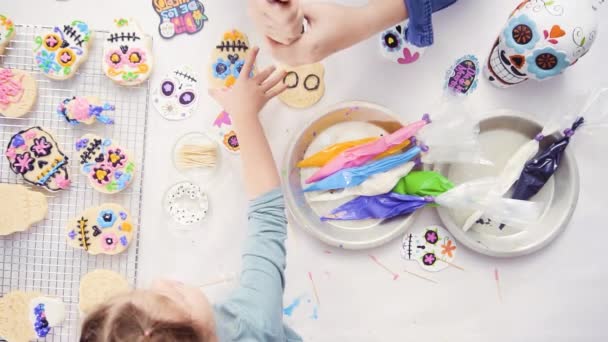 Overhead View Mother Daughter Decorating Sugar Skull Cookies Royal Icing — Stock Video