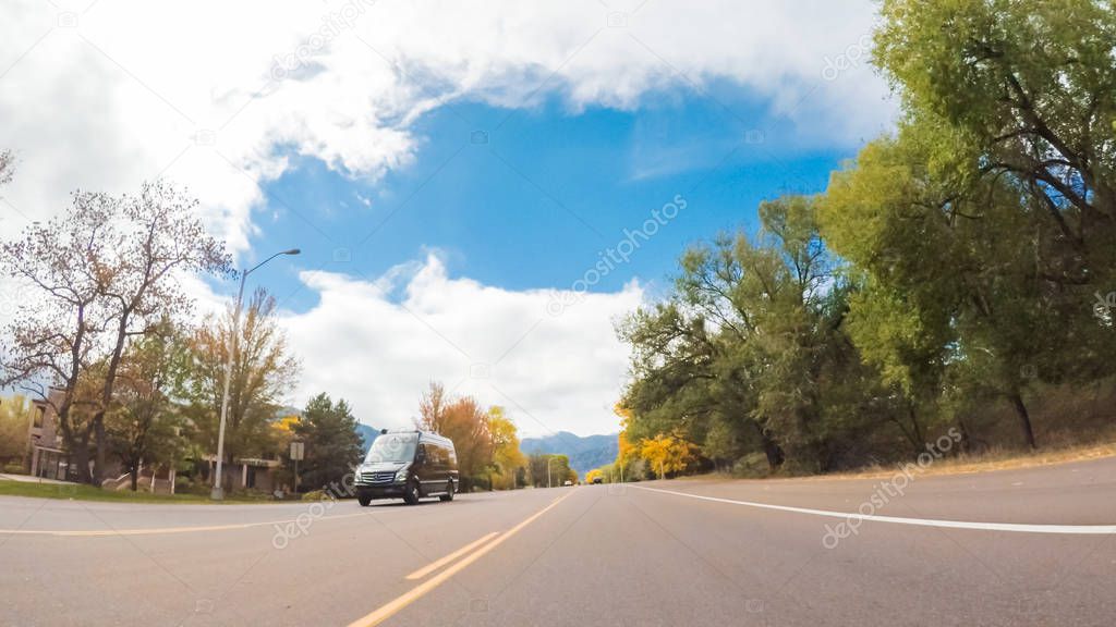 Driving through upscale residential neighborhood of Colorado Springs in Autumn.