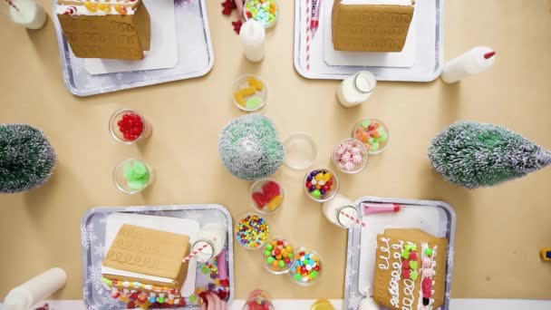 Flat Lay Step Step Kids Decorating Small Gingerbread Houses Christmas — Stock Video